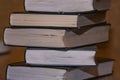 Stack of old books on the table side view closeup Royalty Free Stock Photo