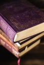 Stack of old dusty books, vintage classic books on the wooden shelf