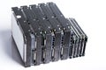 Stack of old hard drives on white background Royalty Free Stock Photo