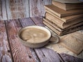 Stack of old hardcover books an a cup of coffee Royalty Free Stock Photo