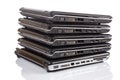 Stack of old laptops awaiting repair Royalty Free Stock Photo