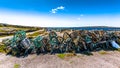 Stack of old lobster / crab cages or fishing traps found on the coast on Inis Oirr island