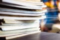 Stack of Old Magazines or books on on black laptop desk background. . selective focus Royalty Free Stock Photo