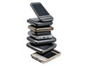 Stack of old mobile phones on white background - generated by ai Royalty Free Stock Photo