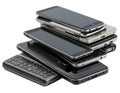 Stack of old mobile phones on white background - generated by ai Royalty Free Stock Photo