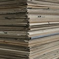 Stack of old newspapers piled vertically, showing layers of folded pages. The paper is Royalty Free Stock Photo