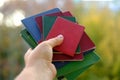 Stack of old personal documents in female hand, passports, diplomas, licenses, social certificates, citizen of USSR middle of Royalty Free Stock Photo