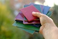 stack of old personal documents in female hand, passports, diplomas, licenses, social certificates, citizen of USSR middle of Royalty Free Stock Photo