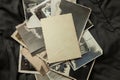 Stack old photos on table. Mock-up blank paper. Postcard rumpled and dirty vintage Royalty Free Stock Photo