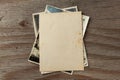 Stack old photos on table. Mock-up blank paper. Postcard rumpled and dirty vintage Royalty Free Stock Photo