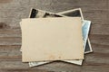 Stack old photos on table. Mock-up blank paper. Postcard rumpled and dirty vintage Royalty Free Stock Photo