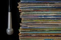 A stack of old records and hanging microphone Royalty Free Stock Photo