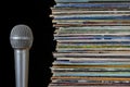 A stack of old records and microphone Royalty Free Stock Photo