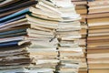 A stack of old school notebooks and a stack of textbooks or books Royalty Free Stock Photo