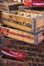 Stack of old soda crates for sale at a flea market Royalty Free Stock Photo