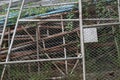 Stack of old steel mesh wall