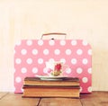 Stack of old suitcase, books and vintage tea cup Royalty Free Stock Photo