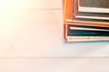 Stack of old used books on white wooden background. Pile of vintage old hardback books. Back to school. Copy space