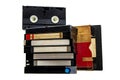 Stack of old VHS video cassette tapes with blank labels isolated on a white back Royalty Free Stock Photo