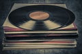 Stack of old vinyl records on the table. Retro style toned image Royalty Free Stock Photo