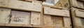 Stack of old wooden packaging boxes standing in column Royalty Free Stock Photo