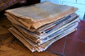 Stack of old yellowed oxidized newspapers
