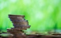 Stack Of One Euro Coins Over green Background Royalty Free Stock Photo