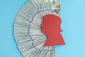 A stack of one hundred dollar bills is on a blue background Royalty Free Stock Photo