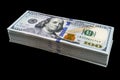 Stack of one hundred dollar bills isolated on black background. Stack of cash money in hundred dollar banknotes. Heap of hundred d Royalty Free Stock Photo