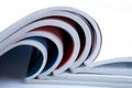 Stack of open glossy magazines on white background Royalty Free Stock Photo