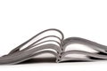 A stack of open magazines on white Royalty Free Stock Photo