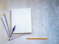 A stack of open notebooks. The handle is on top. Pencil at the bottom of the background. Royalty Free Stock Photo