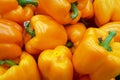 Stack of orange bell peppers on a market stall Royalty Free Stock Photo