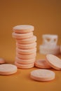 Stack of Orange Effervescent Tablet Dissolving in a Glass of water Royalty Free Stock Photo
