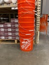 A stack of orange plastic busckets Home Depot home improvement store that have the company logo on them Royalty Free Stock Photo