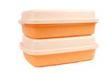 Stack of orange storage plastic containers