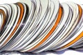 Stack of Orange and White Compact Discs Royalty Free Stock Photo