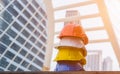 Stack of orange, white, yellow and blue hard safety helmet on floor in construction site. Industry safety health concept Royalty Free Stock Photo