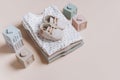 Stack of organic cotton bodysuits, rompers, baby shoes and silicone toys, pyramid. Fashion newborn pastel colors clothes Royalty Free Stock Photo