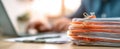 The stack of organized paperwork beside a laptop in a professional workspace..AI generated image Royalty Free Stock Photo
