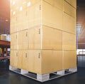 Stack of Package Boxes on Wooden Pallet at Storage Warehouse. Shipment Boxes. Cargo Export- Import. Royalty Free Stock Photo