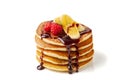 Stack of pancakes with banana,raspberries and chocolate syrup on white Royalty Free Stock Photo