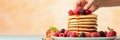 Stack of pancakes with berries. Advertising banner, web banner. Lush delicious pancakes with blueberries, raspberries