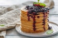 Stack of pancakes with berry sauce.