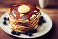 Stack of pancakes with blueberries and honey. Shallow DOF