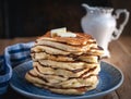 Stack of pancakes with butteron wooden background Royalty Free Stock Photo