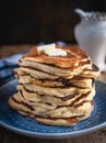 Stack of pancakes with butteron wooden background Royalty Free Stock Photo