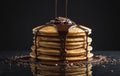A stack of pancakes with chocolate sauce and pieces on serveware