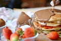 Stack of Pancakes With Chocolate Sauce and Strawberries Royalty Free Stock Photo