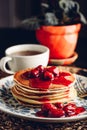 Stack of pancakes with cornelian cherry jam on plate Royalty Free Stock Photo